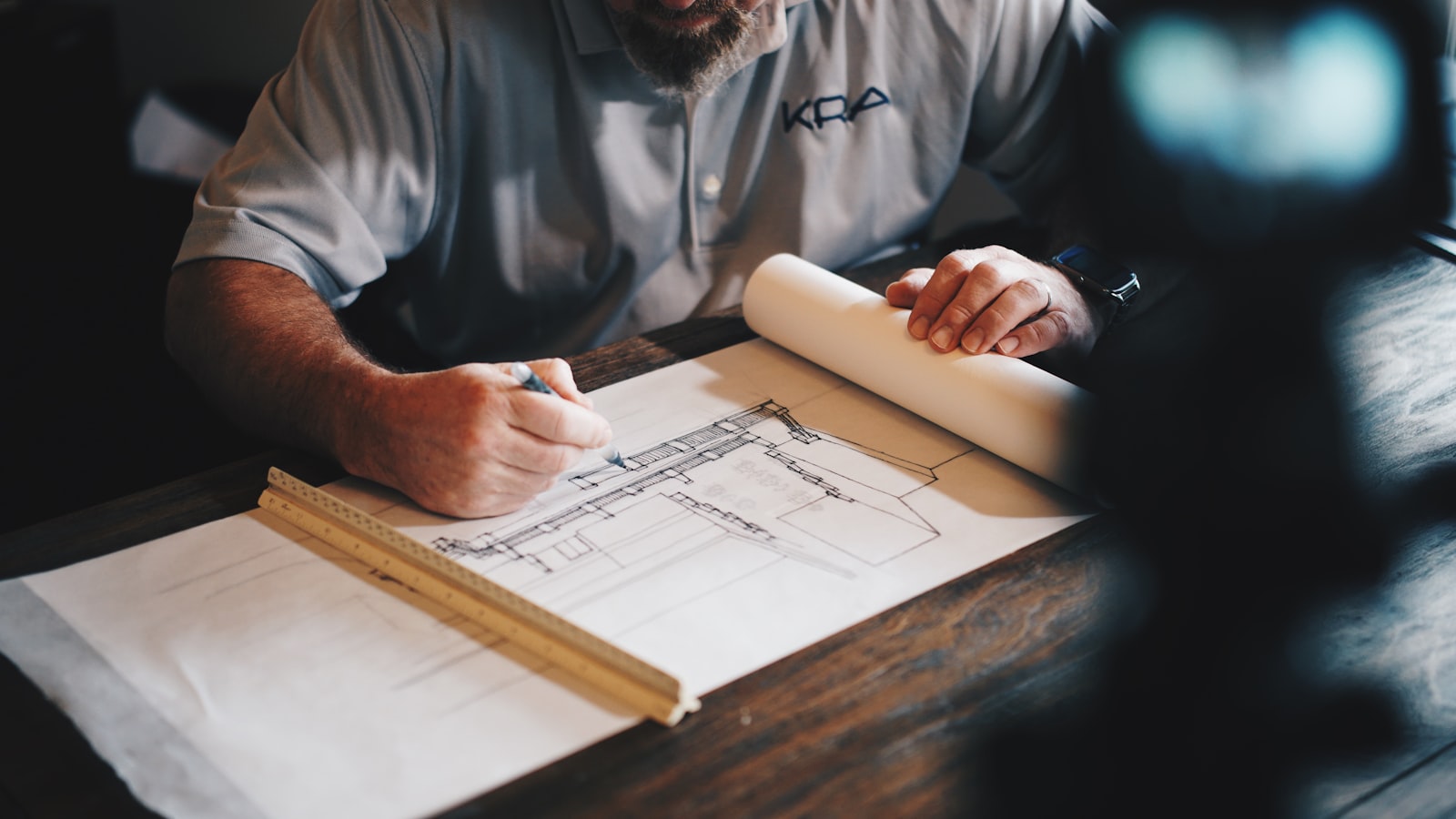 Engineer working over construction drawings